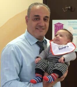 Samuel Botros, MD with baby